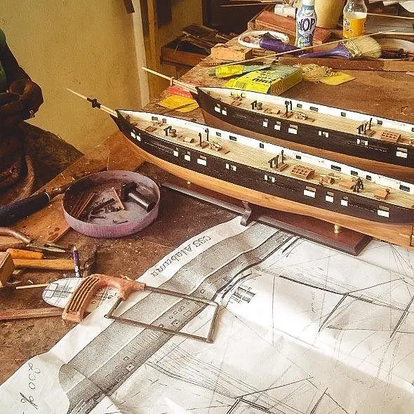 Bobato artisan workshop with handcrafted ship model in progress